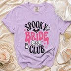 Lavender t-shirt with "Spooky Bride Club" graphic, featuring bats and ghosts.