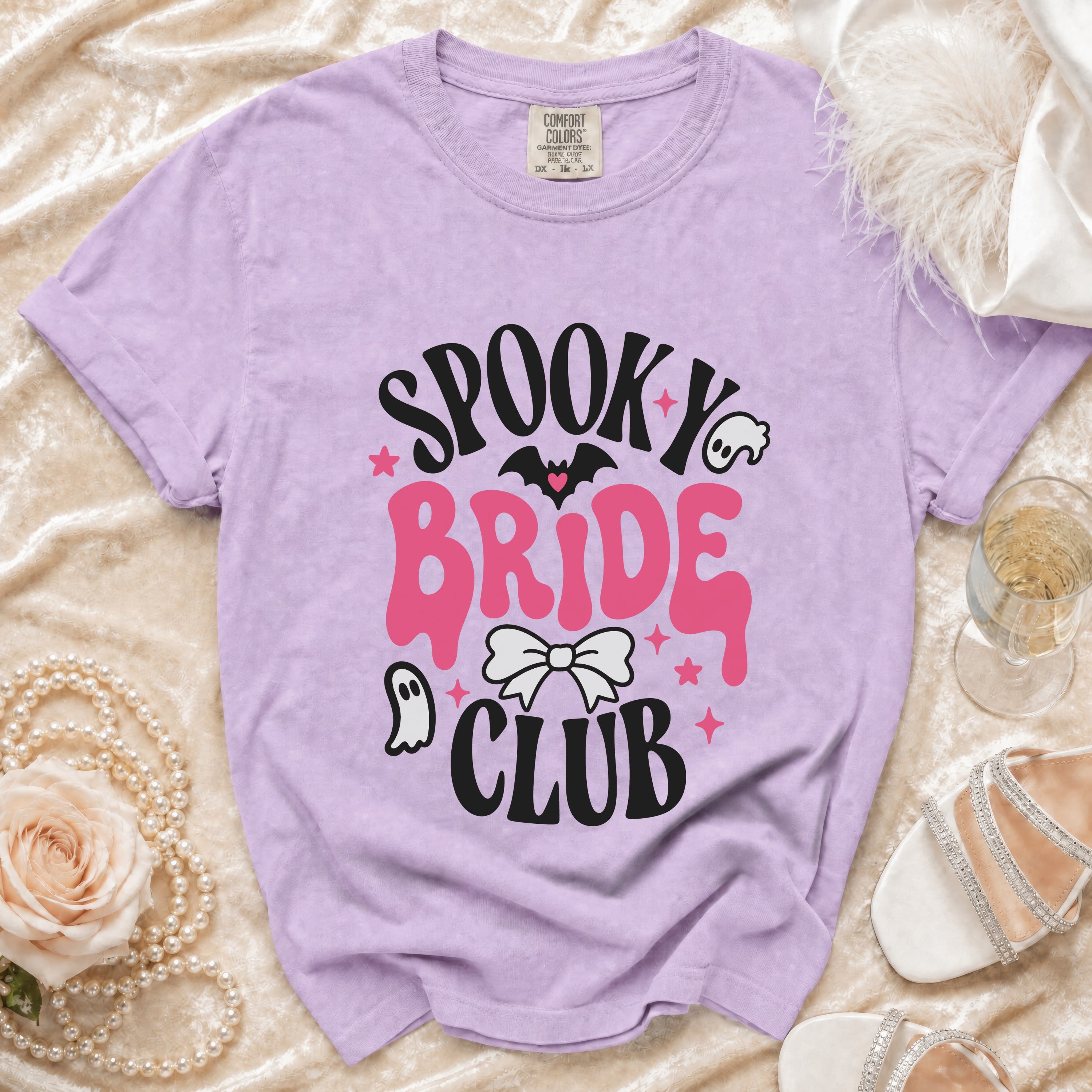 Lavender t-shirt with "Spooky Bride Club" graphic, featuring bats and ghosts.