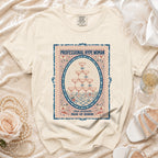 Cream t-shirt with oval graphic: "PROFESSIONAL HYPE WOMAN, chaos coordinator MAID OF HONOR".