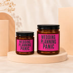 Two candles with "WEDDING PLANNING PANIC" text on pink labels.
