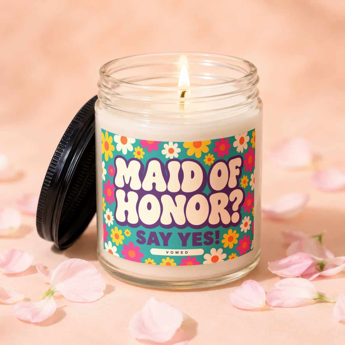 Candle with lit wick and "Maid of Honor? Say Yes!" text on a floral background.