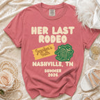 Coral t-shirt with "Her Last Rodeo Jennifer's Bach Nashville, TN Summer 2026" text.