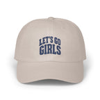 A beige baseball cap features embroidered blue text that reads LET'S GO GIRLS across the front panels.