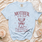 Light blue t-shirt with "Mother of the Bride Professional Cryer & Budget Holder" graphic.