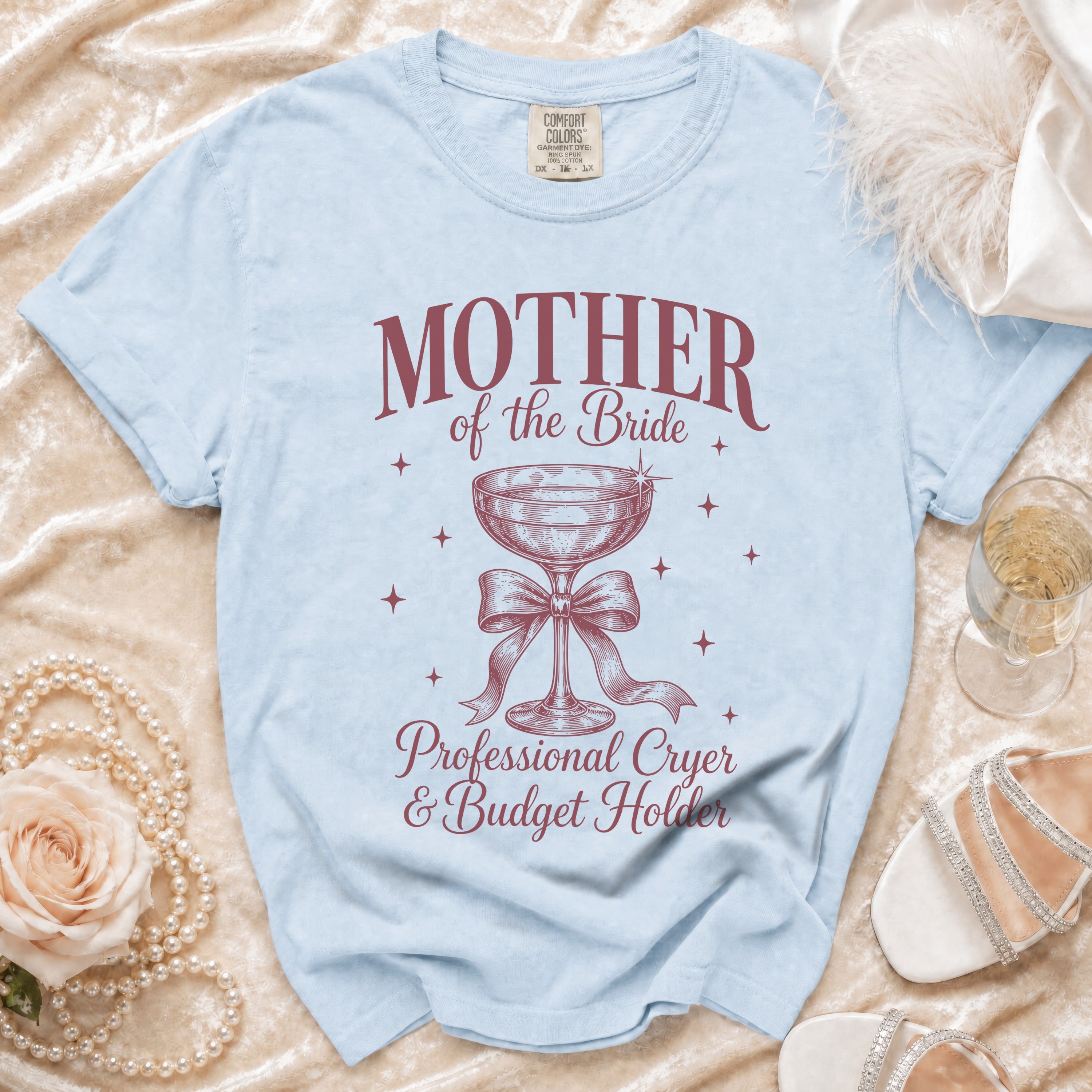 Light blue t-shirt with "Mother of the Bride Professional Cryer & Budget Holder" graphic.