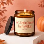 Amber candle with "She's Getting Married. I'm Not Okay. send wine." text.