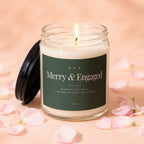 Candle with "Merry & Engaged" text, surrounded by pink petals.