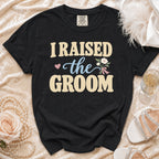 Black t-shirt with "I RAISED the GROOM" graphic and floral accent.