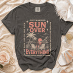 Dark grey t-shirt with "Just Married Sun Over Everything" graphic and beach scene.