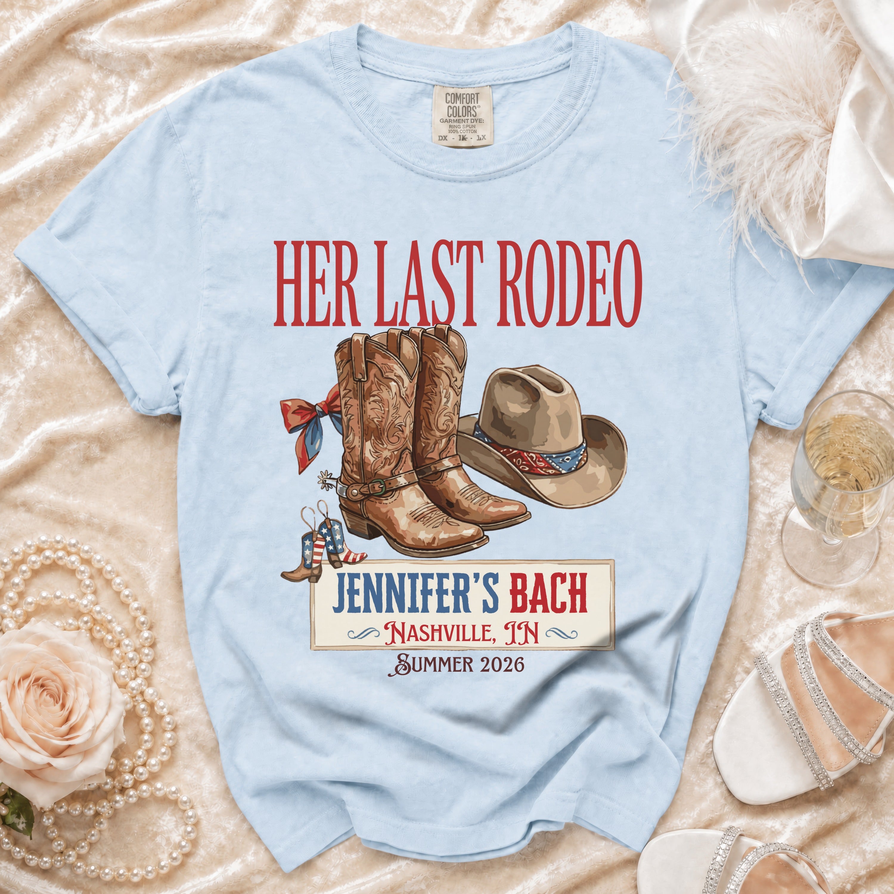 Light blue t-shirt with "Her Last Rodeo Jennifer's Bach Nashville Summer 2026" graphic.