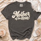 Charcoal t-shirt with cream "Mother of the Bride!" text, Comfort Colors tag.