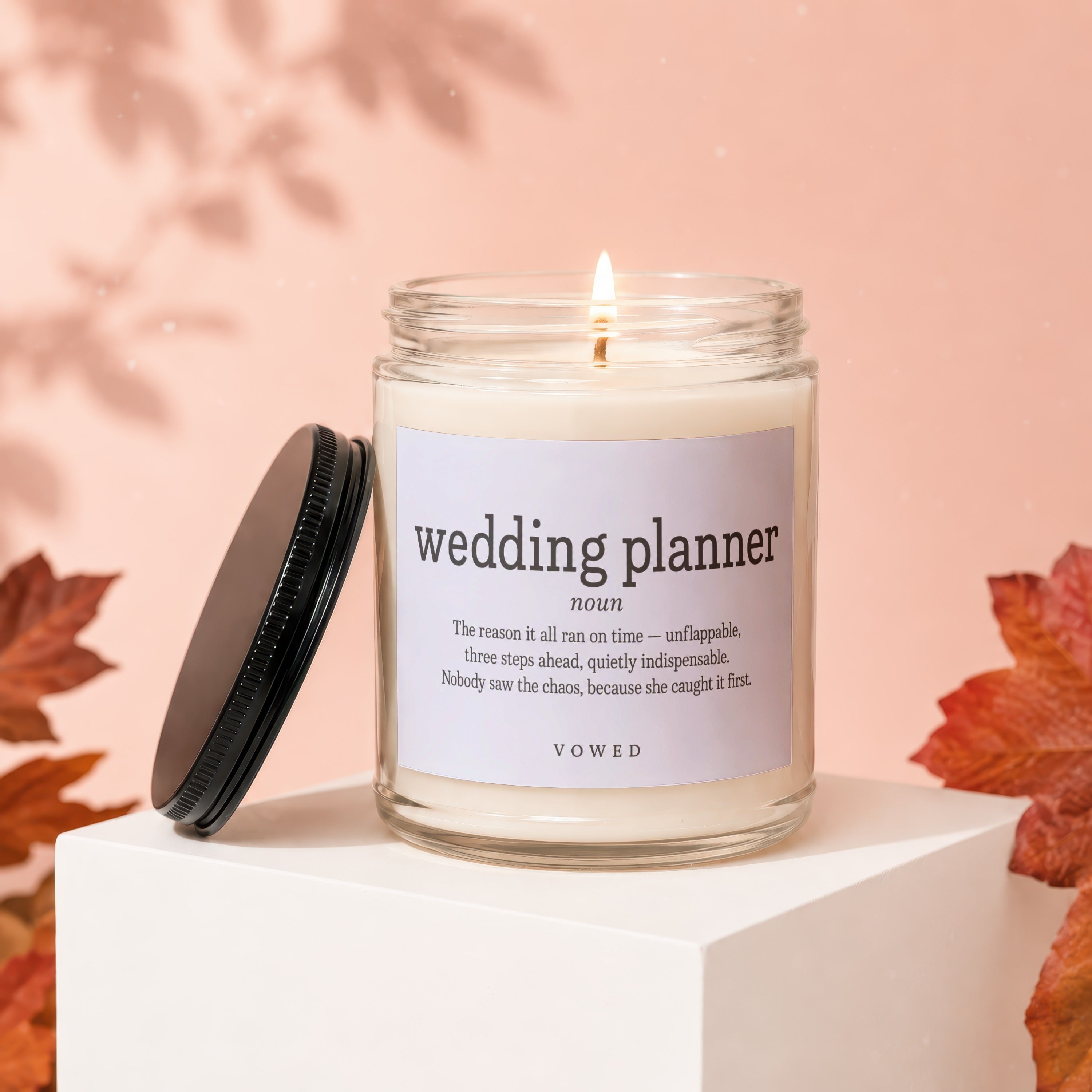 Candle with "Wedding Planner noun" definition label and burning wick.