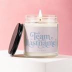 Jar candle with a lid beside it reads "Team [Lastname] Vowed."