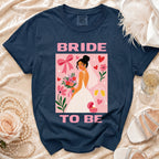 Navy t-shirt with "BRIDE TO BE" text and graphic of a bride holding flowers.