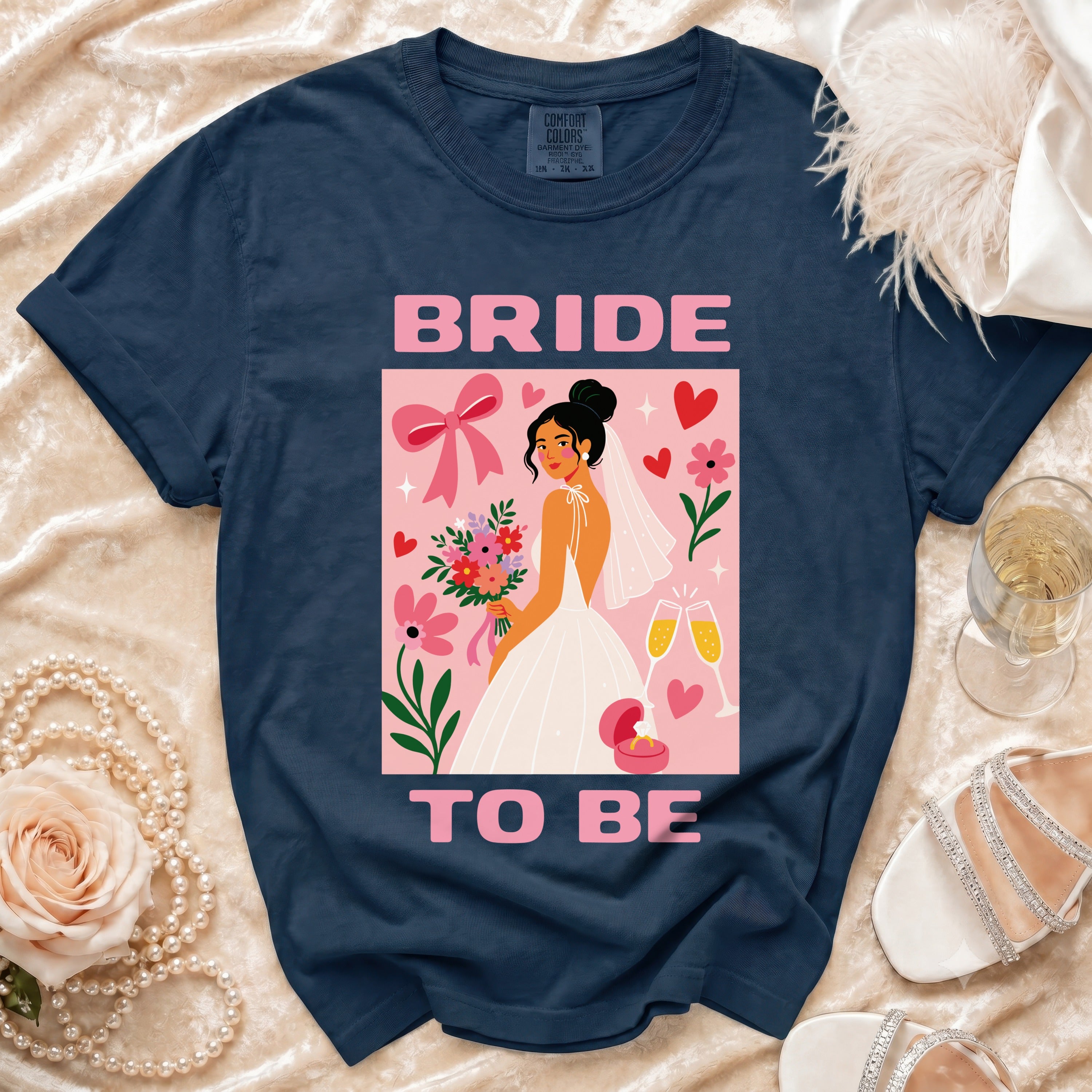 Navy t-shirt with "BRIDE TO BE" text and graphic of a bride holding flowers.