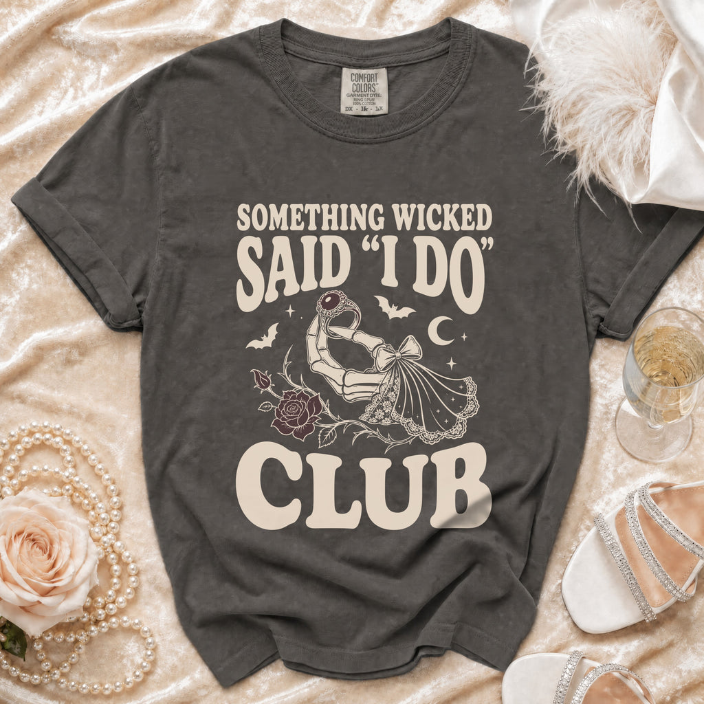 Dark grey t-shirt with "Something Wicked Said I Do Club" text and skeleton hand holding ring.