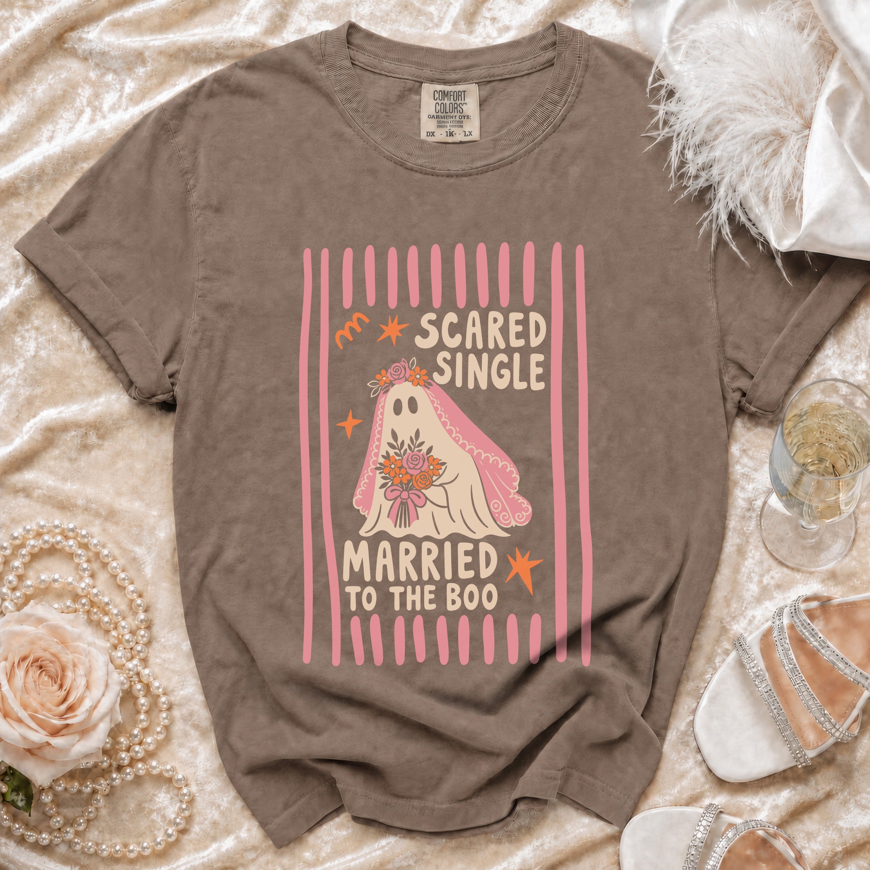 Brown Comfort Colors t-shirt with "Scared Single Married to the Boo" ghost graphic.