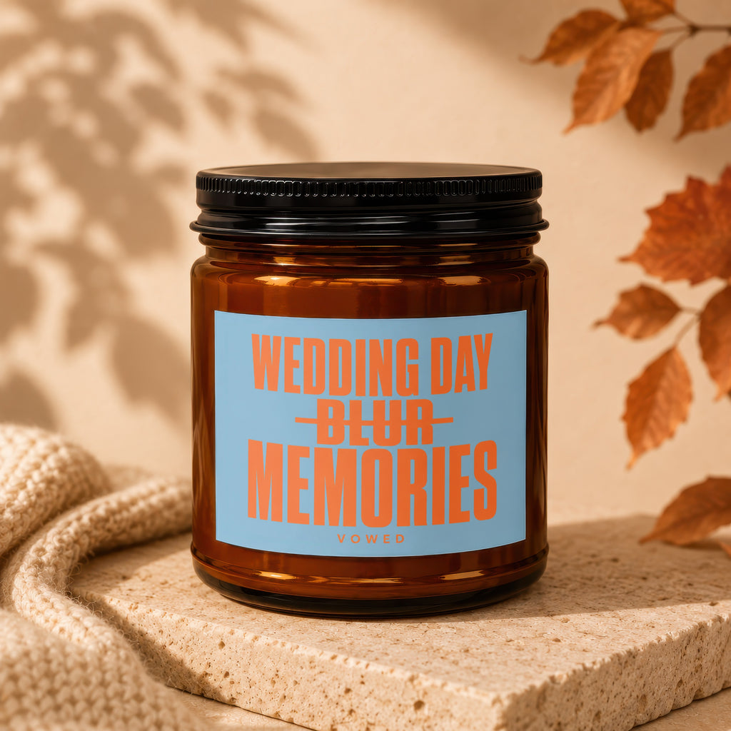 Amber glass candle with blue label reading "WEDDING DAY BLUR MEMORIES VOWED".