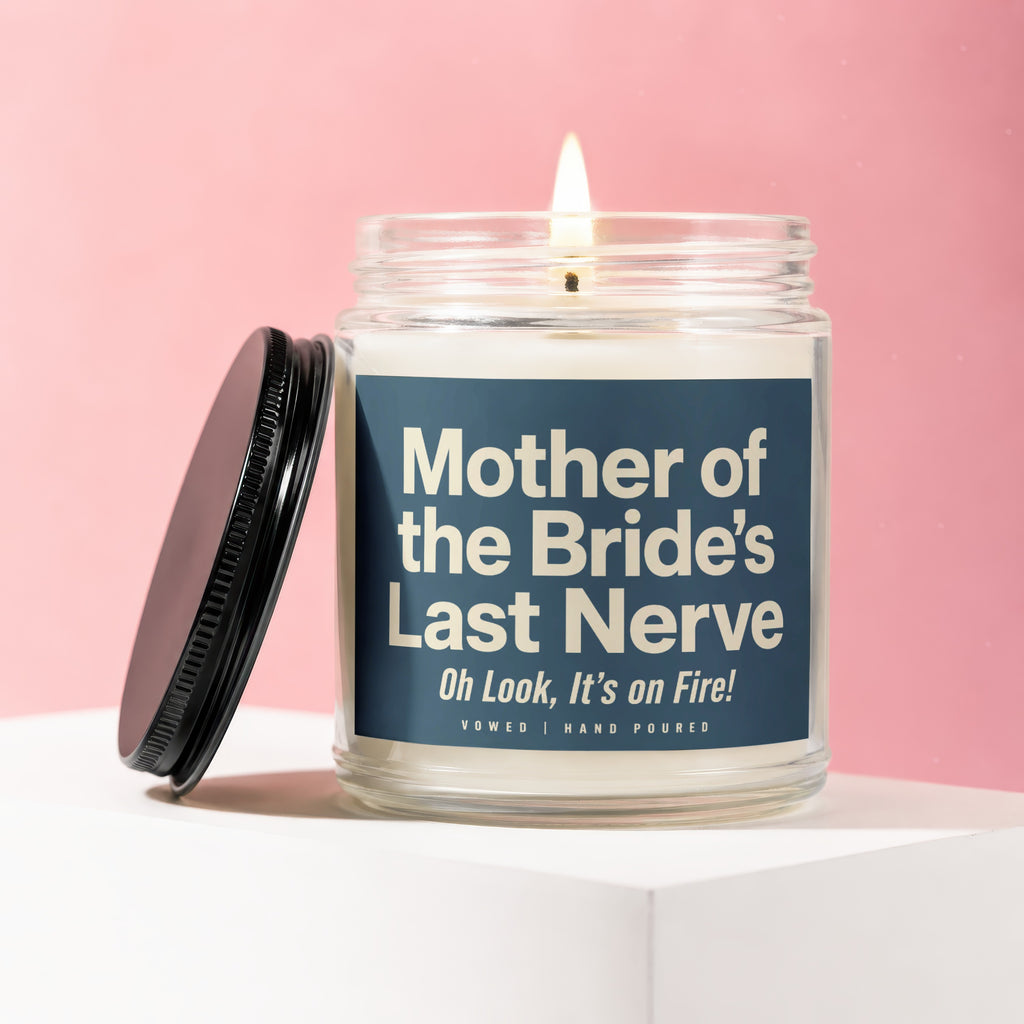 Jar candle with "Mother of the Bride's Last Nerve" text, lit flame.