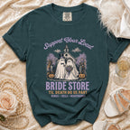 T-shirt with "Support Your Local Bride Store" and ghost couple graphic.