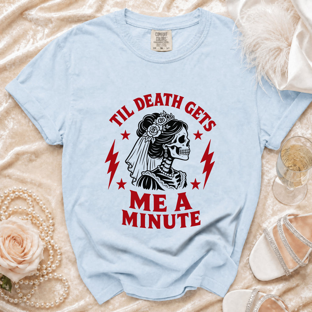 Light blue t-shirt with skull bride graphic and "Til Death Gets Me A Minute" text.