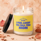 Lit candle in glass jar with "I feel lucky to call you MOM" on yellow label.