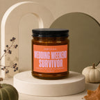 Candle with "Wedding Weekend Survivor" label, "Three Days. Zero Sleep. Full Commitment. Vowed."