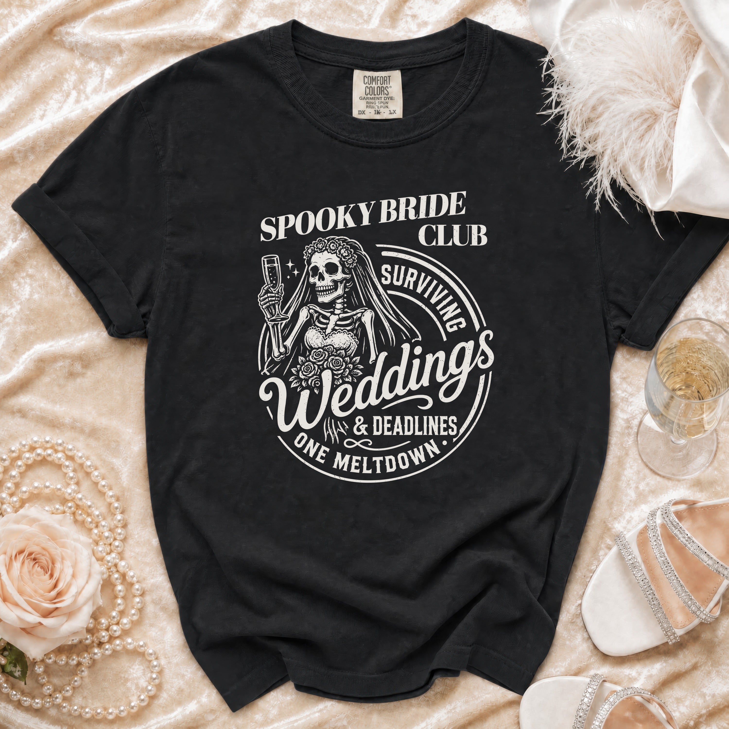 Black t-shirt with "Spooky Bride Club Surviving Weddings & Deadlines One Meltdown" graphic.