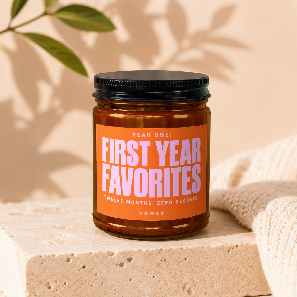 Amber jar with black lid labeled "Year One: First Year Favorites, Twelve Months. Zero Regrets."