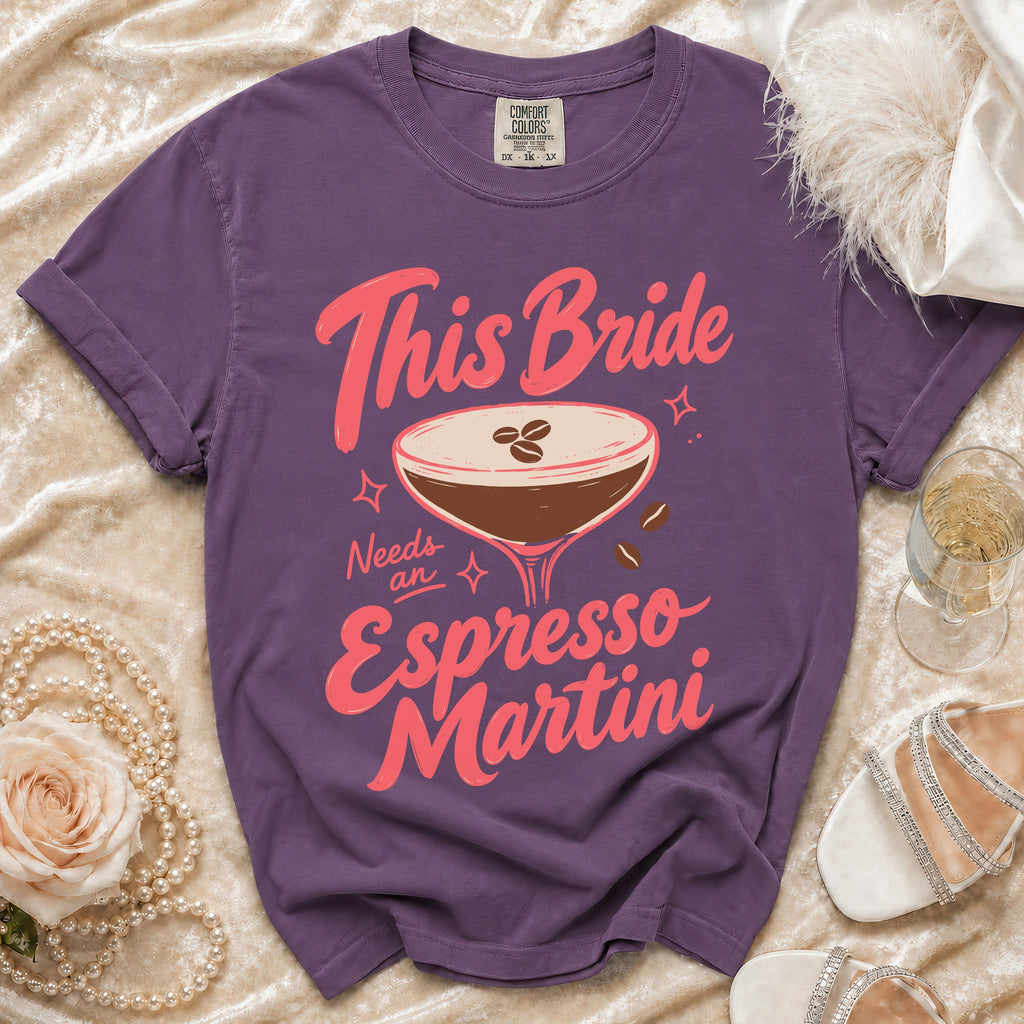 Purple t-shirt with pink text "This Bride Needs an Espresso Martini" and cocktail graphic.
