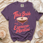 Purple t-shirt with pink text "This Bride Needs an Espresso Martini" and cocktail graphic.