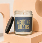 Glass candle with "Wedding Chaos Proceed with Champagne" label, lid off.