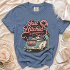 Blue t-shirt with "Just Hitched & Unsupervised" graphic of couple in convertible.