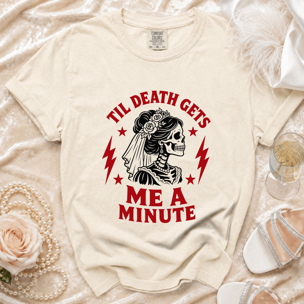 Cream t-shirt with skeleton bride graphic and text "Til Death Gets Me A Minute".