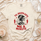 Cream t-shirt with skeleton bride graphic and text "Til Death Gets Me A Minute".