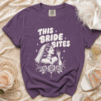 Purple t-shirt with "This Bride Bites" graphic, showing a bride and roses.