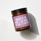 Brown glass candle with lavender label: "Mother of the Bride's Last Nerve - Oh Look, It's On Fire!"