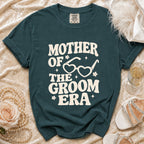 Teal t-shirt with "Mother Of The Groom Era" text and heart-shaped glasses.