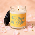 Candle with lit wick and yellow label reading "Two grooms, endless love"