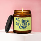 Amber jar candle with lit flame and black lid, labeled "Future Spouses Club, vowed."