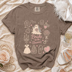 Brown Comfort Colors t-shirt with "Bride to be (Beware)" graphics and gothic bridal elements.