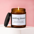 Amber candle with lit flame and "wedding planner noun" text.