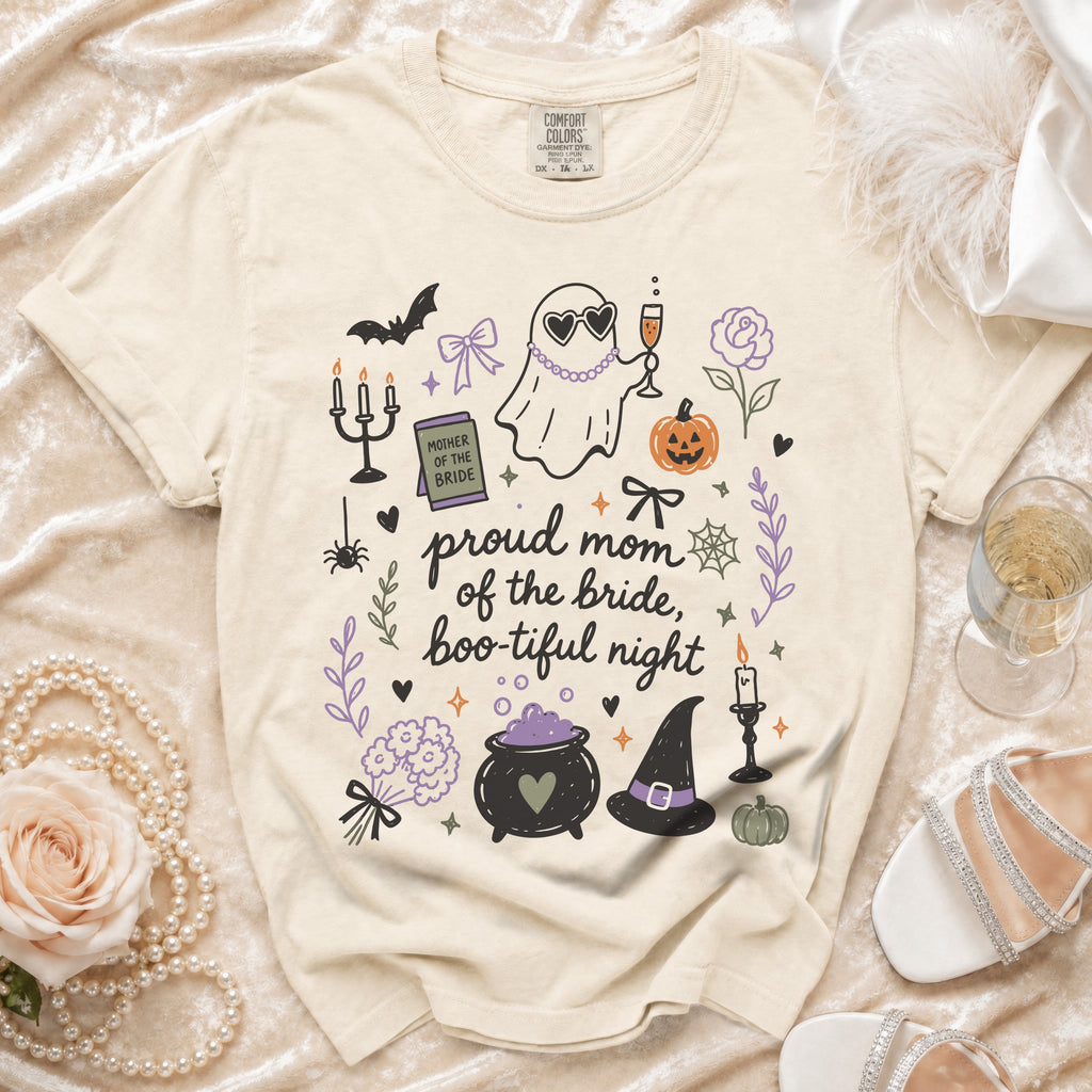 Cream t-shirt with "proud mom of the bride, boo-tiful night" and Halloween graphics.