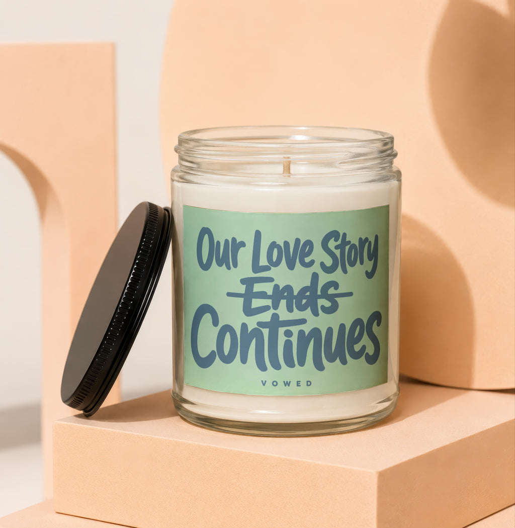 Glass candle with lid, reads "Our Love Story Ends Continues" VOWED.