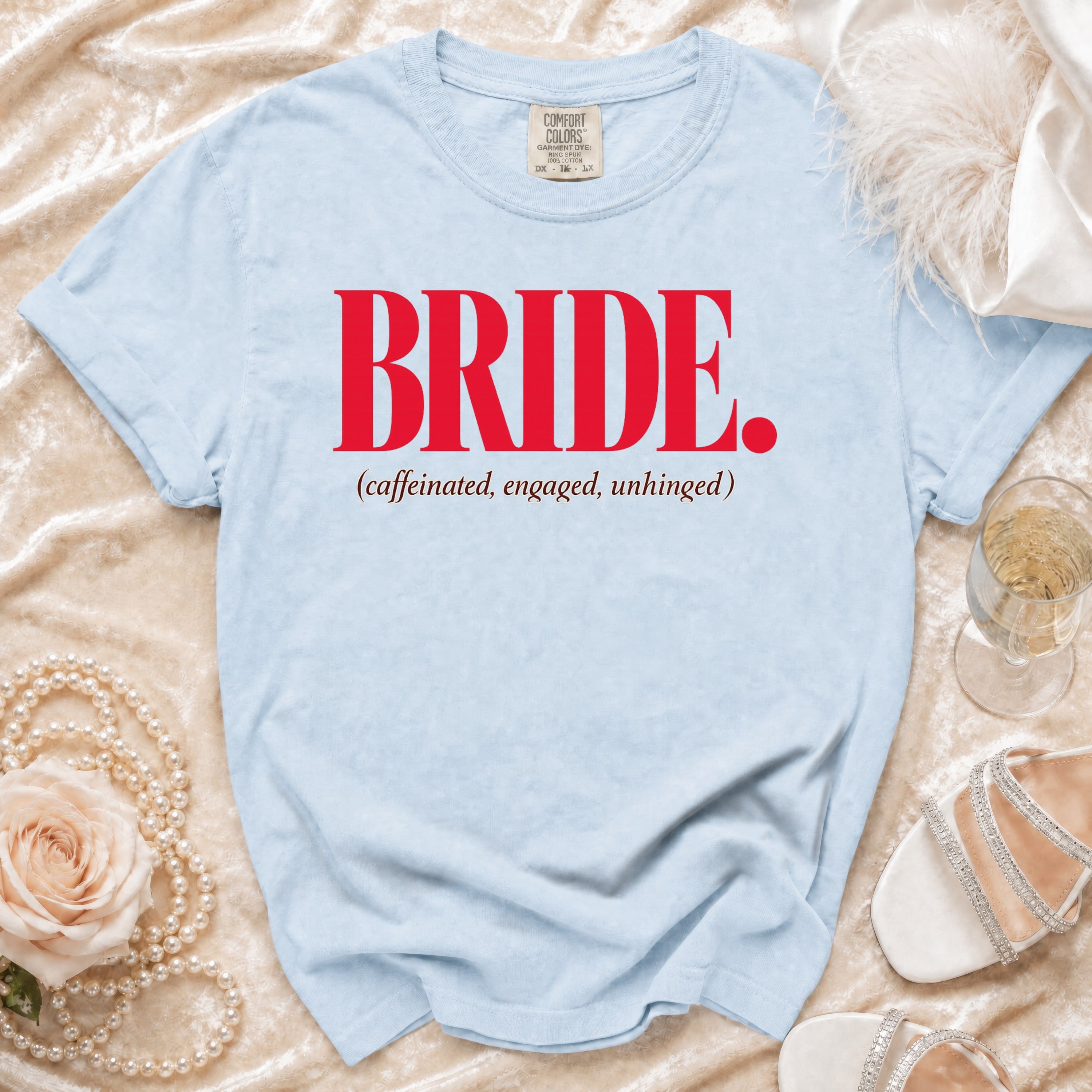 Light blue t-shirt with "BRIDE. (caffeinated, engaged, unhinged)" in red text.