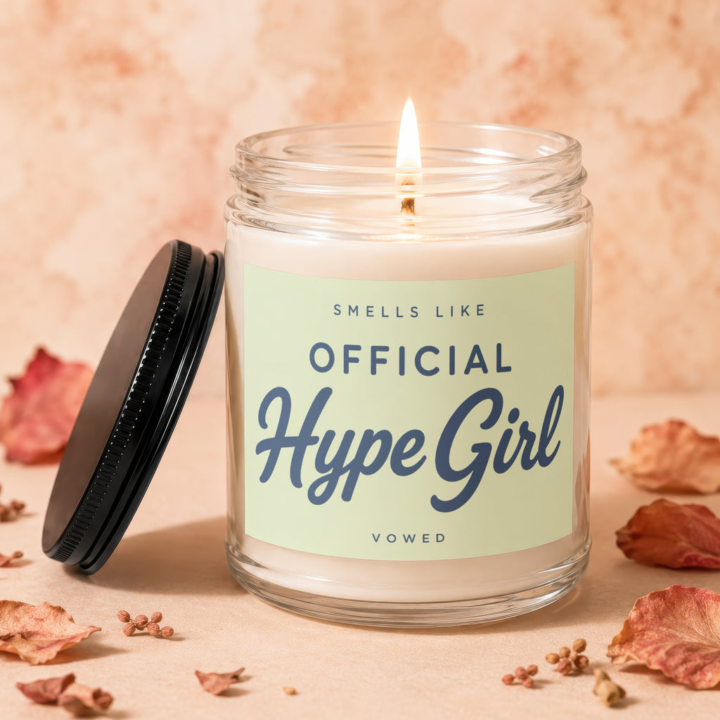 Jar candle with lit wick, reads "Smells Like Official Hype Girl".