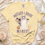 Yellow t-shirt with ghost, pumpkin, flowers, and text "Mother of the Bride Market".