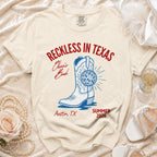 T-shirt with "Reckless in Texas" and boot graphic, Austin, TX, Summer 2026.