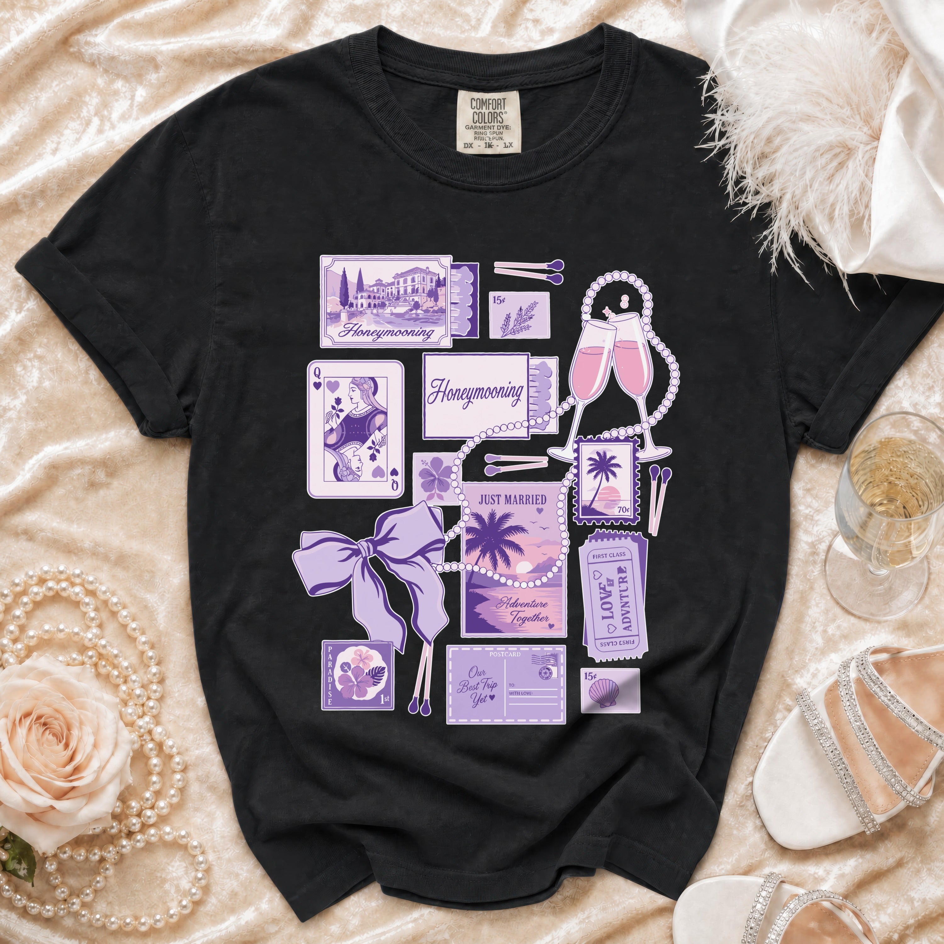 Black t-shirt with purple honeymooning inspired graphics including tickets and vintage postcards.