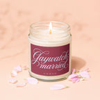Candle with "Gaywatch married VOWED" text and pink flower petals.